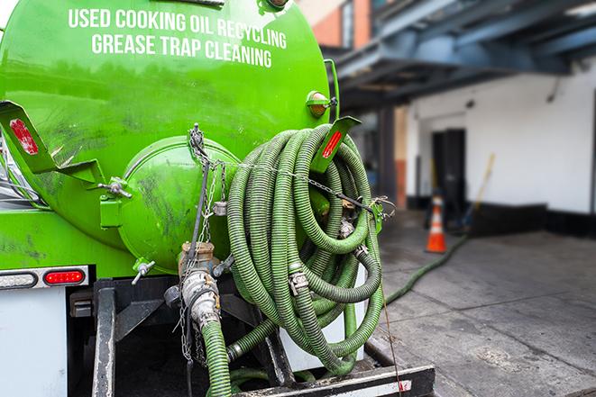 septic tank pump truck in operation in Beverly Hills