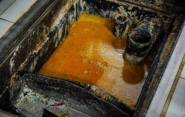 neglecting grease trap cleaning can lead to clogs, foul odors, and even sewage backups